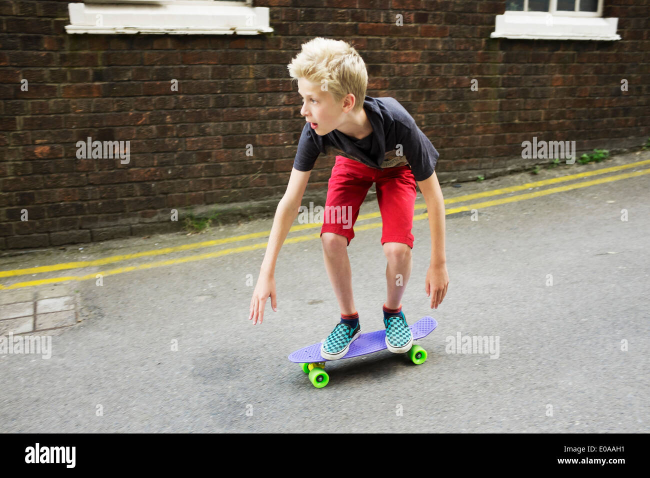 Young Boy Skateboarding High Resolution Stock Photography and Images - Alamy