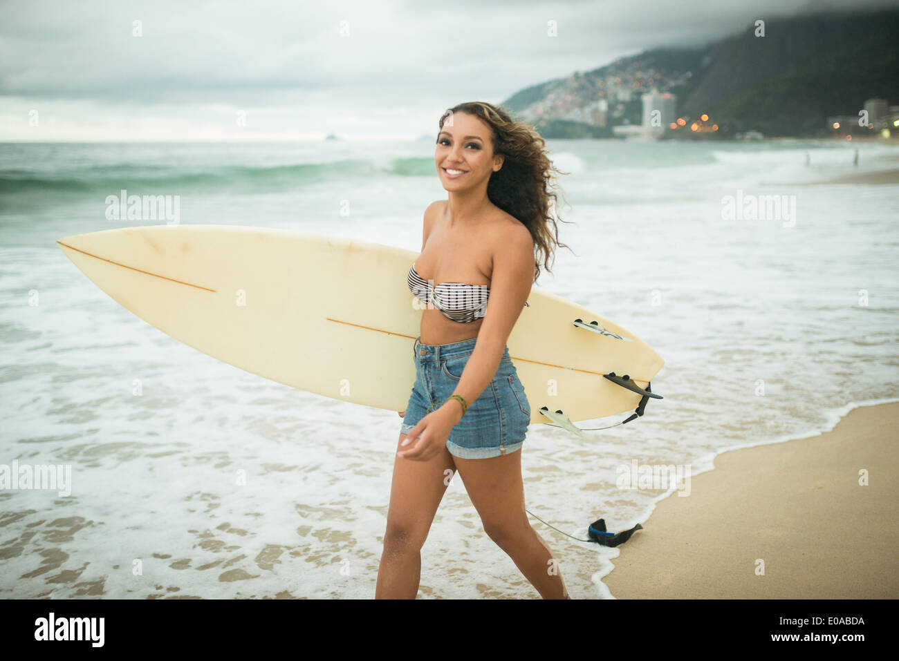 Young woman with surfboard Stock Photo