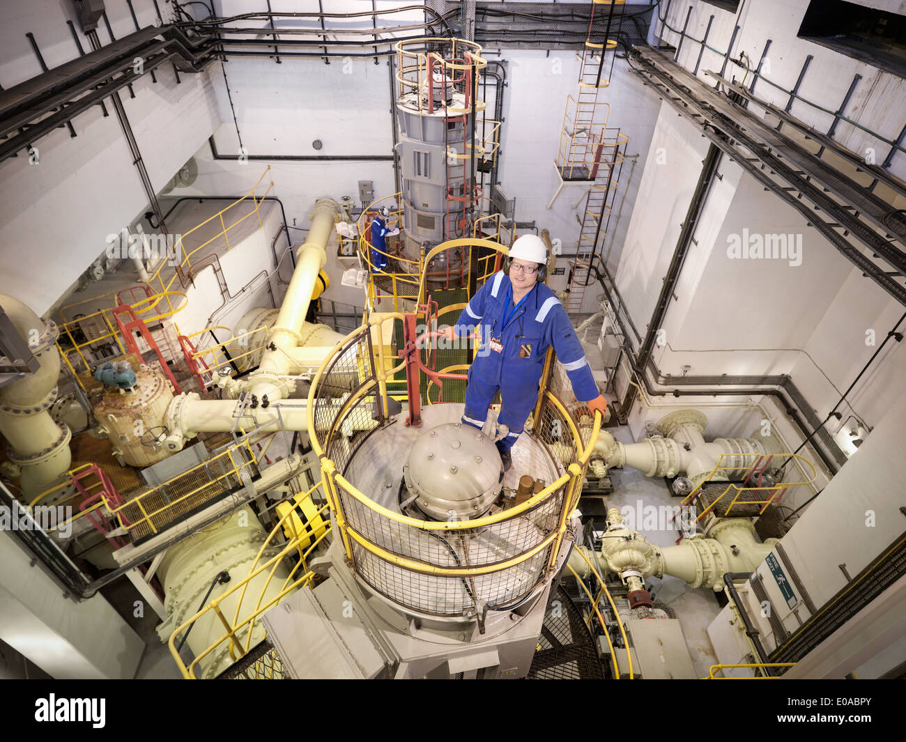 Portrait of engineer in seawater pumping station of power station, high angle view Stock Photo