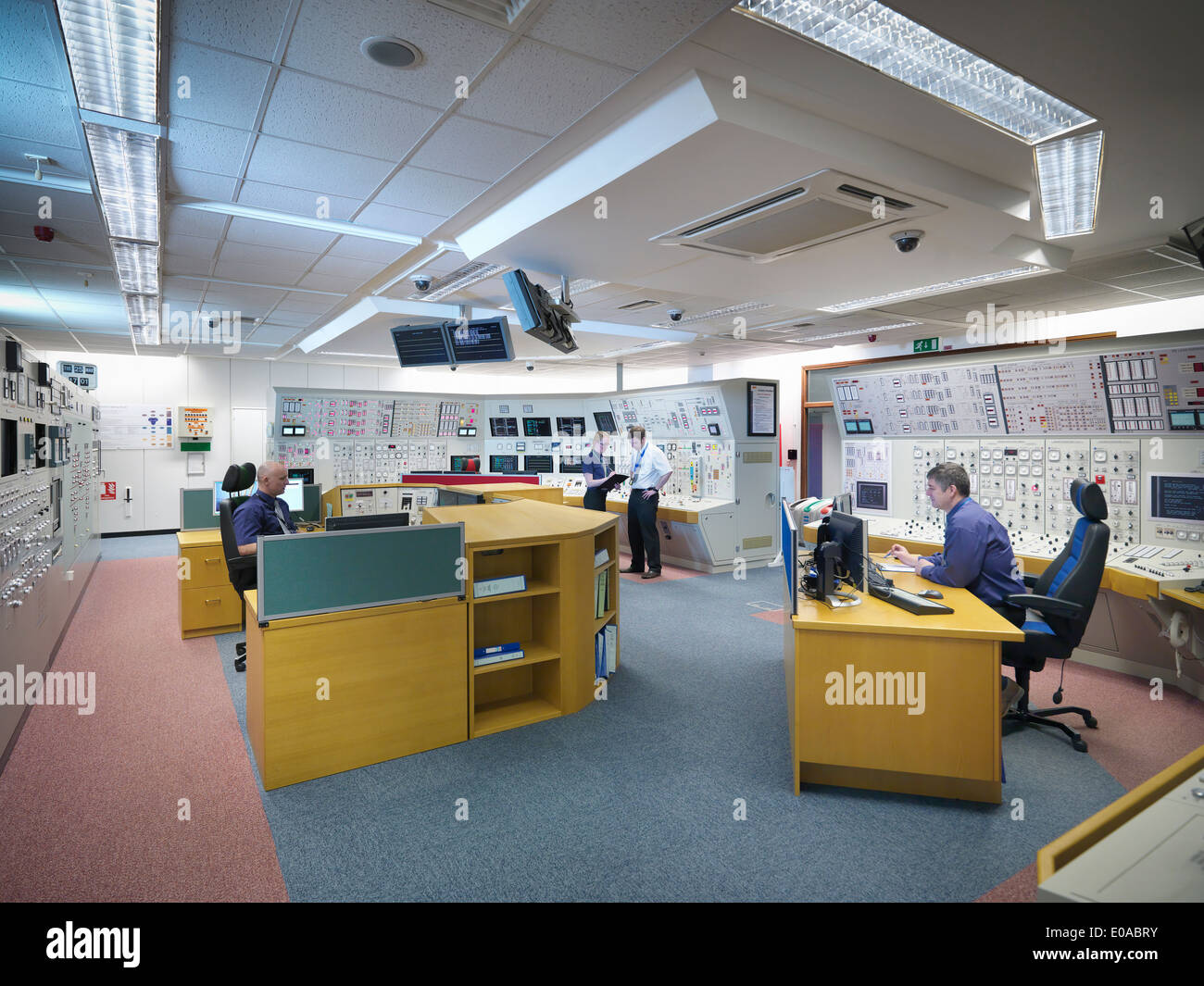 Engineers working in nuclear power station control room simulator Stock Photo