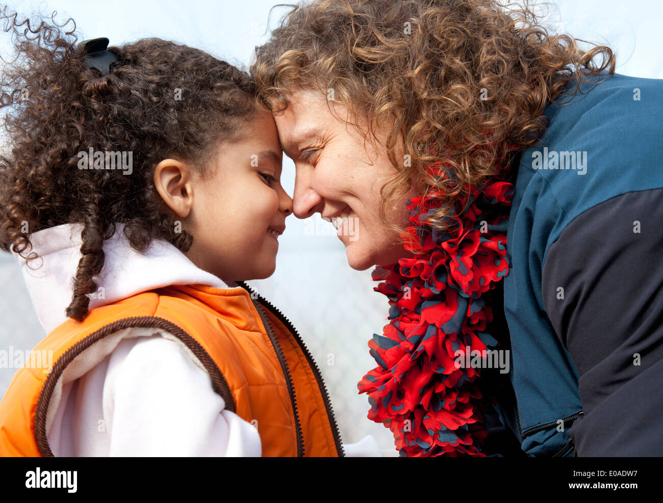 mother and daughter nose to nose showing affection Stock Photo