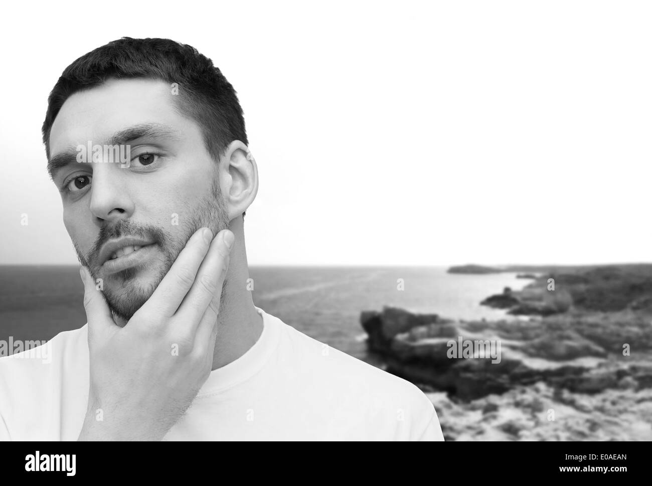 beautiful calm man touching his face Stock Photo