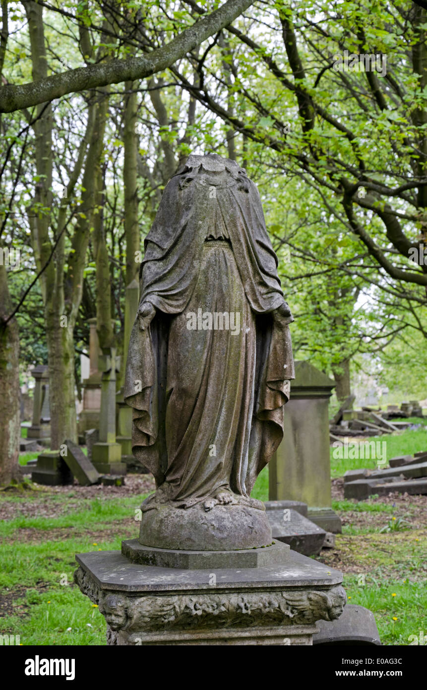A headless statue of Christ in the much neglected North Merchiston Cemetery in Edinburgh, Scotland, UK. Stock Photo