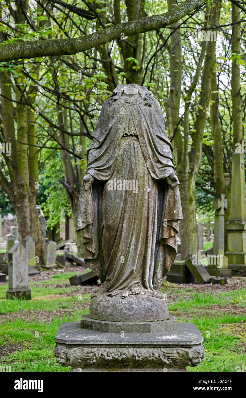 A headless statue of Christ in the much neglected North Merchiston Cemetery in Edinburgh, Scotland, UK. Stock Photo