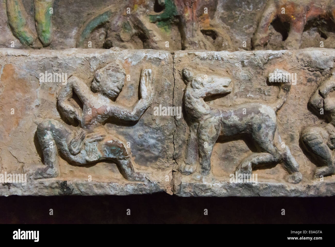 Stone carving of martial art and tiger at Shitthaung Temple, Mrauk-U, Rakhine State, Myanmar Stock Photo