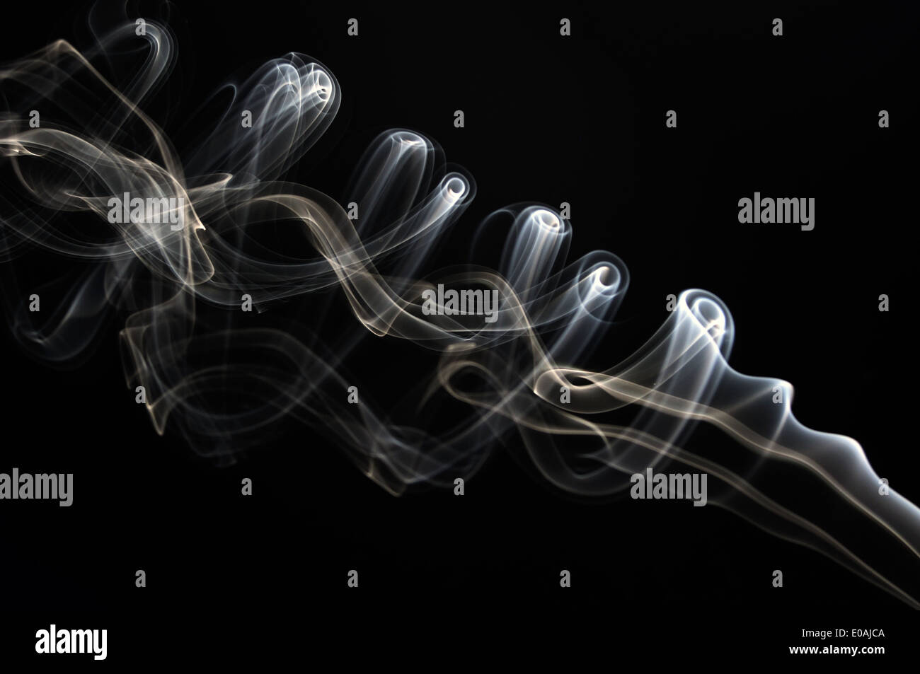 Abstract smoke pattern isolated on black background Stock Photo - Alamy