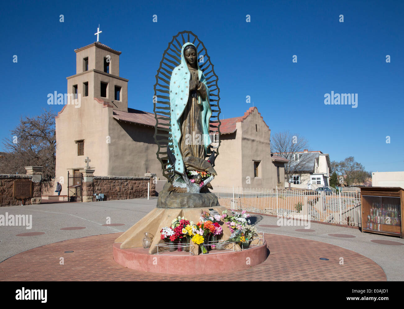 Our Lady of Guadalupe statue at El Santuario de Guadalupe, an old mission church built in 1781, with blue sky in Santa Fe, New Mexico, USA Stock Photo