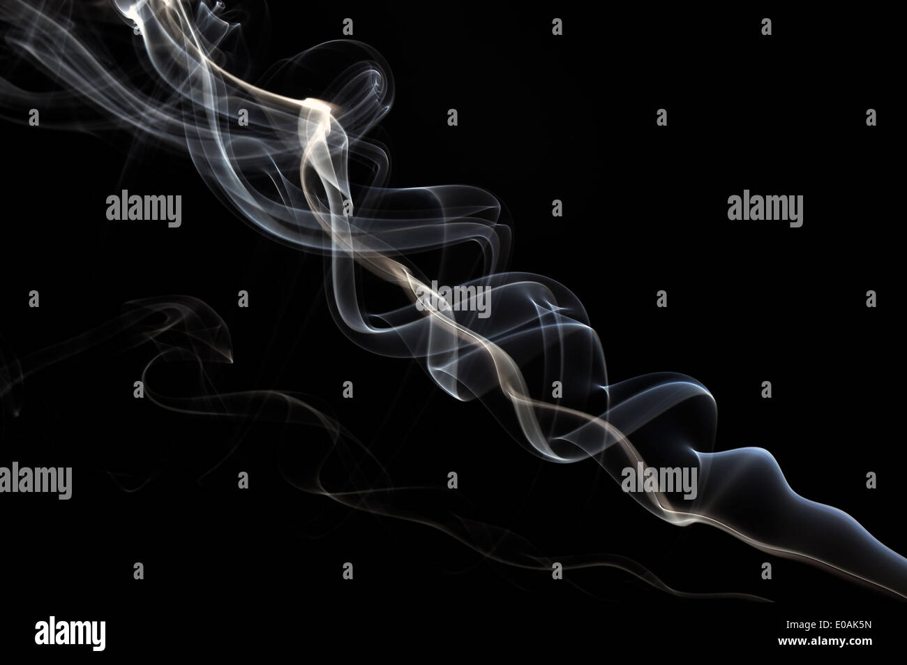 Abstract smoke pattern isolated on black background Stock Photo - Alamy