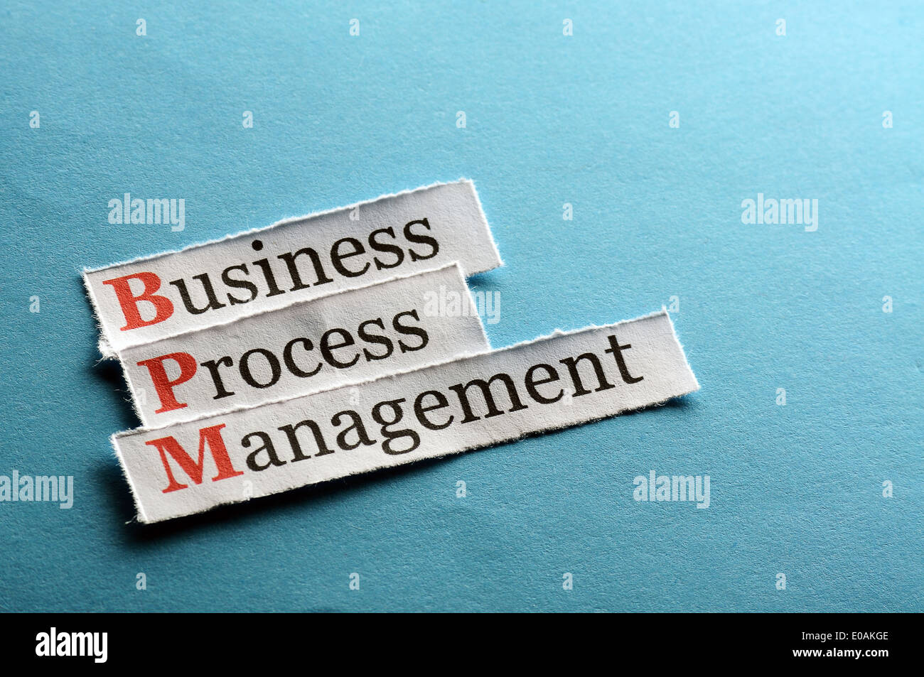 BPM business process management on blue paper Stock Photo