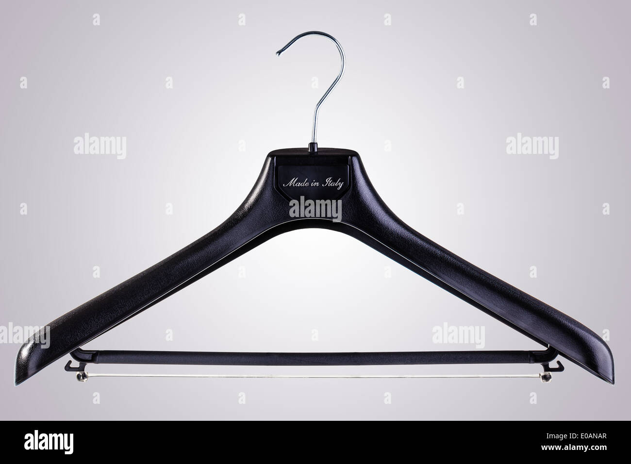 a black plastic clothes hanger isolated over a white background Stock Photo