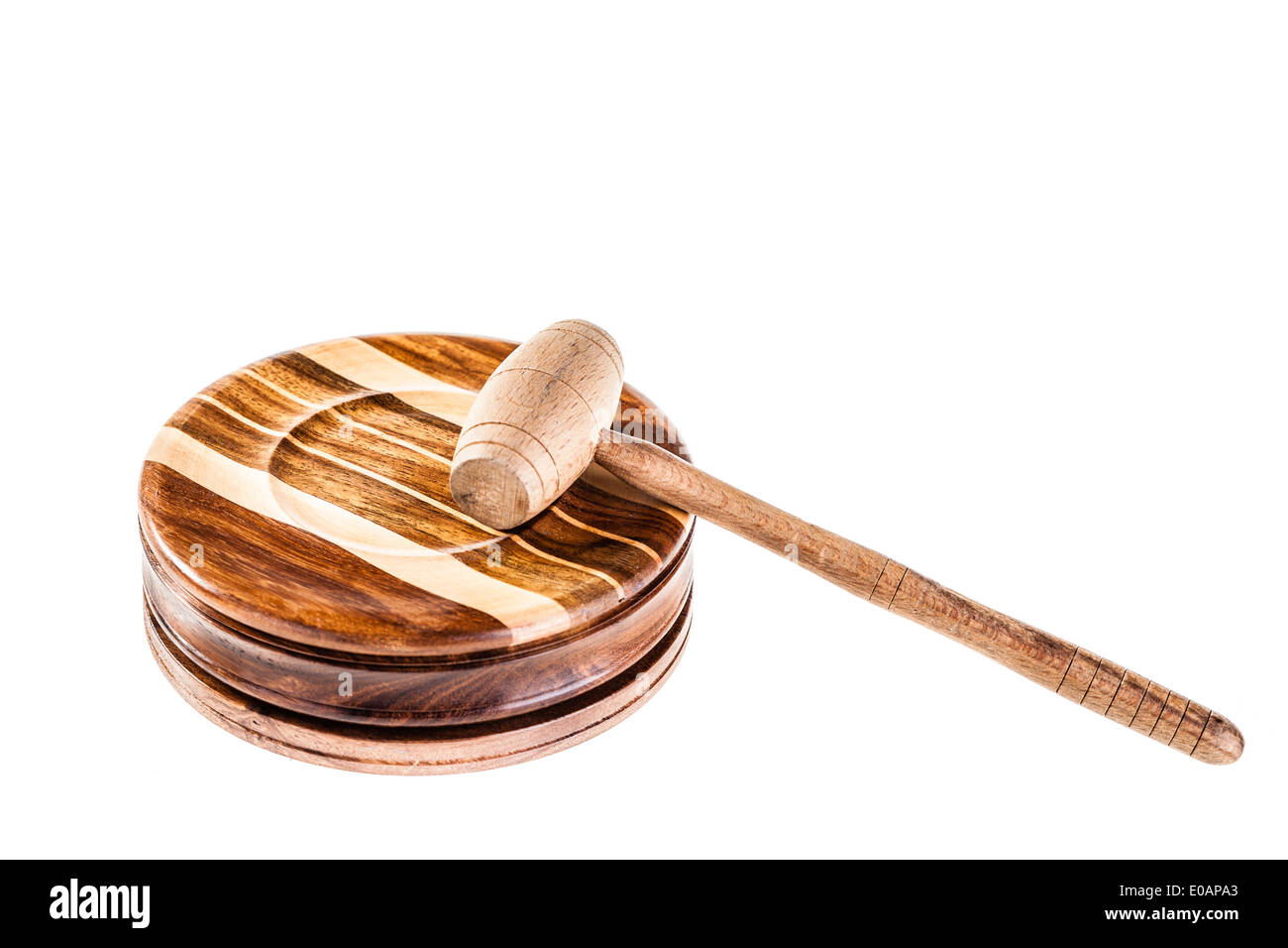 a judge's hammer made of wood and isolated over a white background Stock Photo