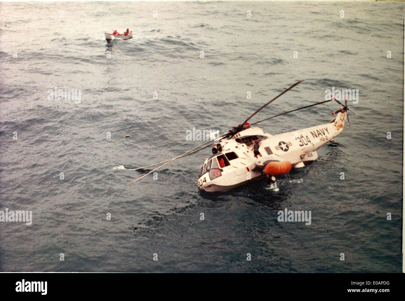 Navy HS-2 being repaired by USS Hornet after open sea landing Stock Photo