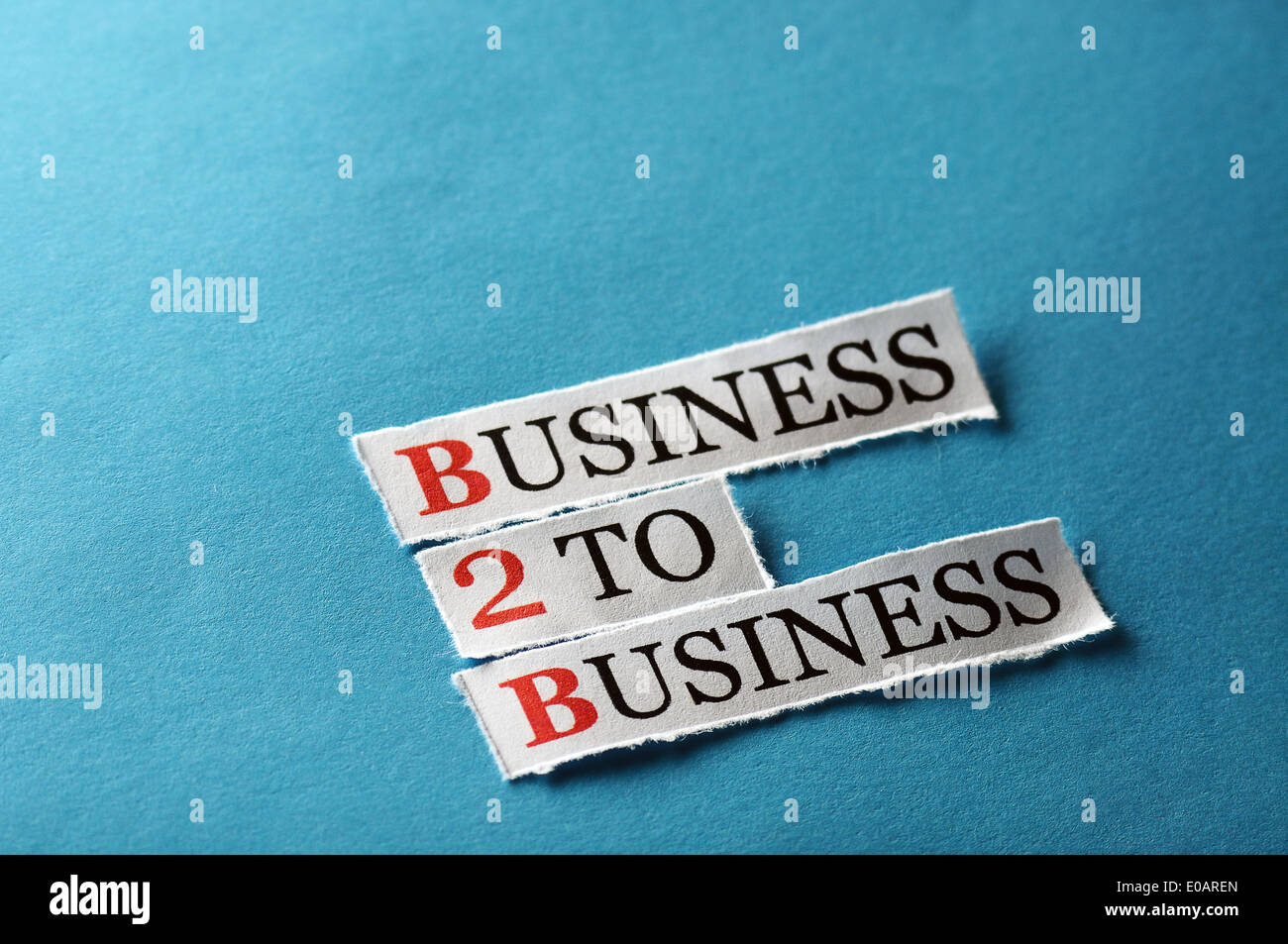 b2b acronym, words on cut paper hard light Stock Photo