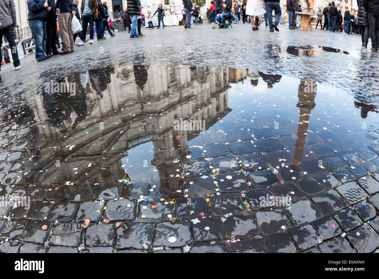 Italy, Rome, Piazza Navona, Church Sant Agnese in Agone reflecting in puddle Stock Photo