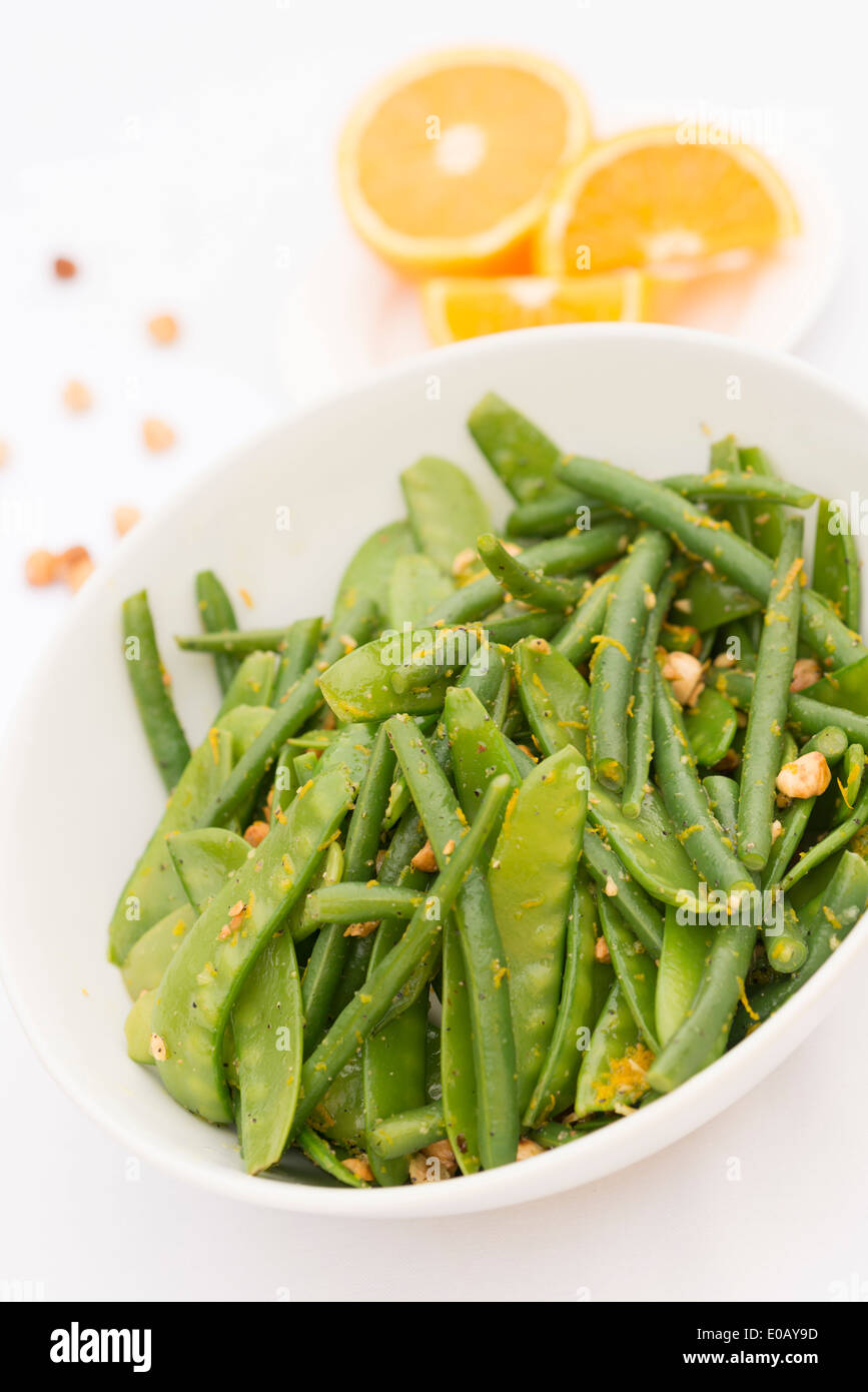 Green sweet pea, bean, hazelnut and orange salad Stock Photo Alamy