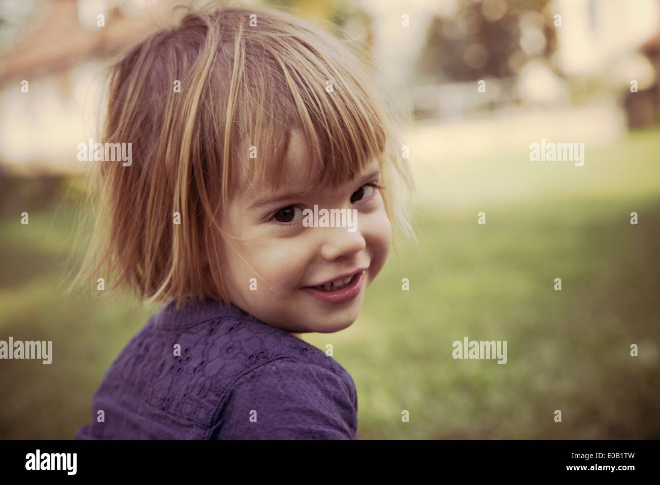 Portrait of smiling little girl Stock Photo - Alamy