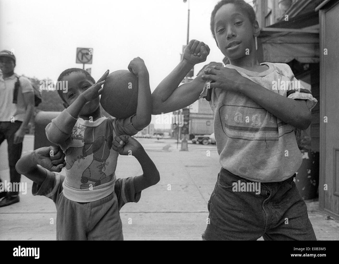 Children play basketball outside the Terminal Hotel on West 23rd Street near the West Side Highway. Stock Photo