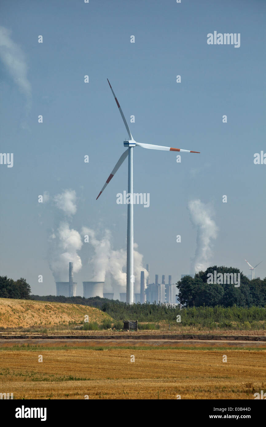 Germany, North Rhine-Westphalia, Wind turbine in front of brown coal power station Stock Photo