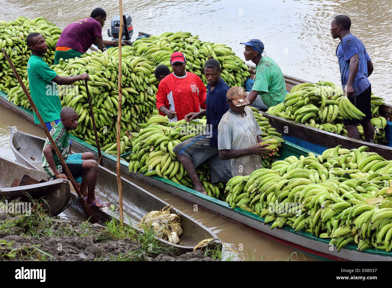 Bananas are loaded, boats on the river Rio Baudo, Choco province, Colombia Stock Photo