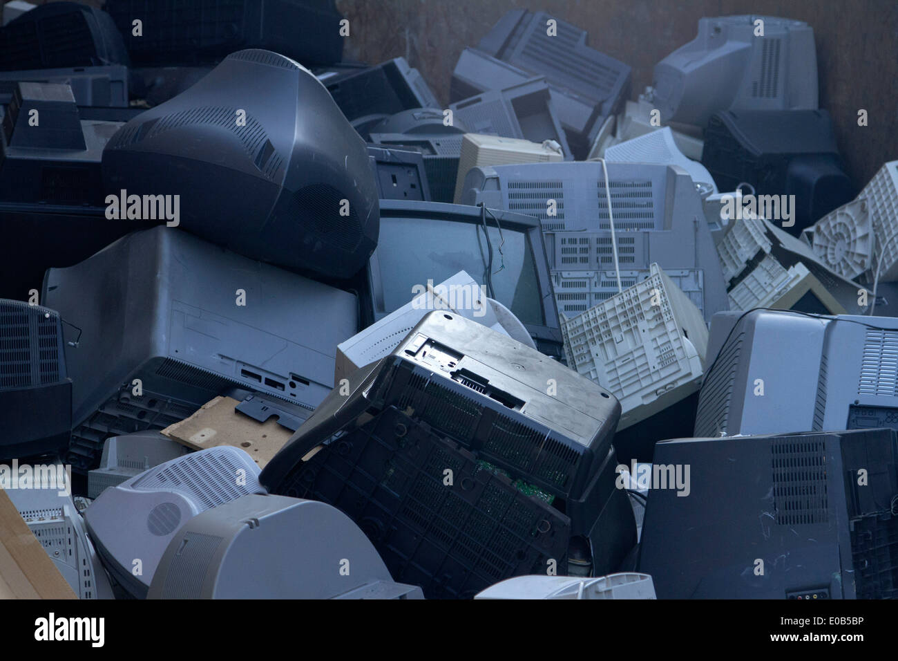 Pile of old computers and television sets at recycling yard Stock Photo