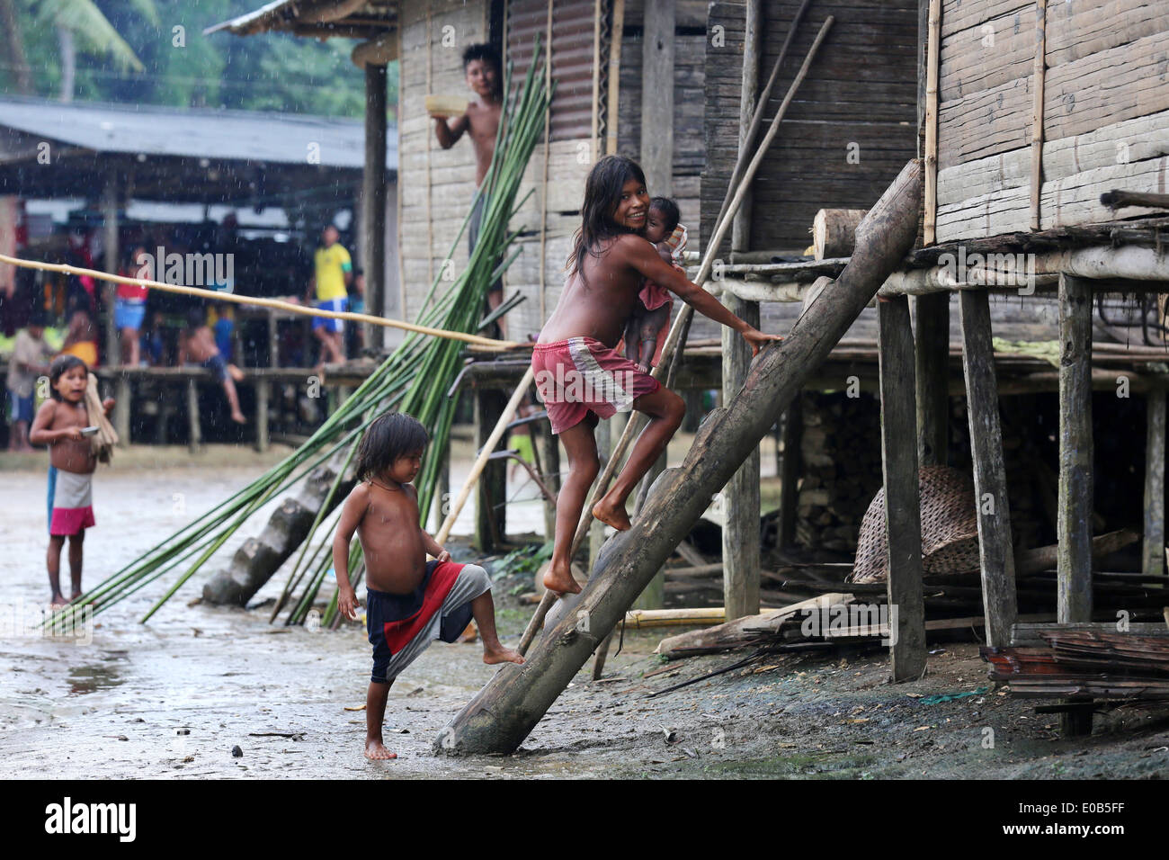 indigenous tribes people and wooden houses on stilts in the jungle village Puerto Alegre Nauca,  Choco province,  Colombia Stock Photo