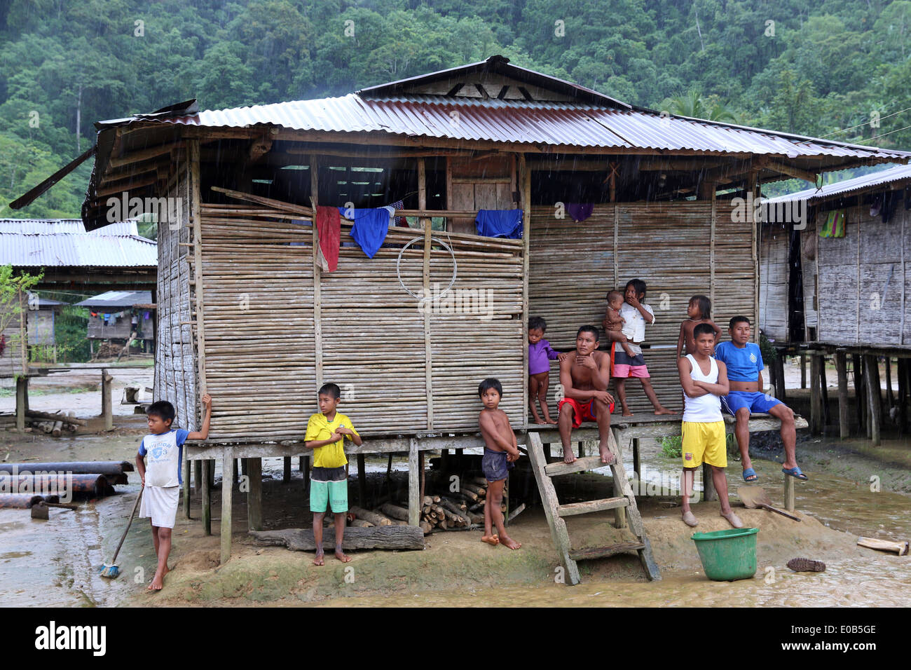 indigenous tribes people and wooden houses on stilts in the jungle village Puerto Alegre Nauca,  Choco province,  Colombia Stock Photo