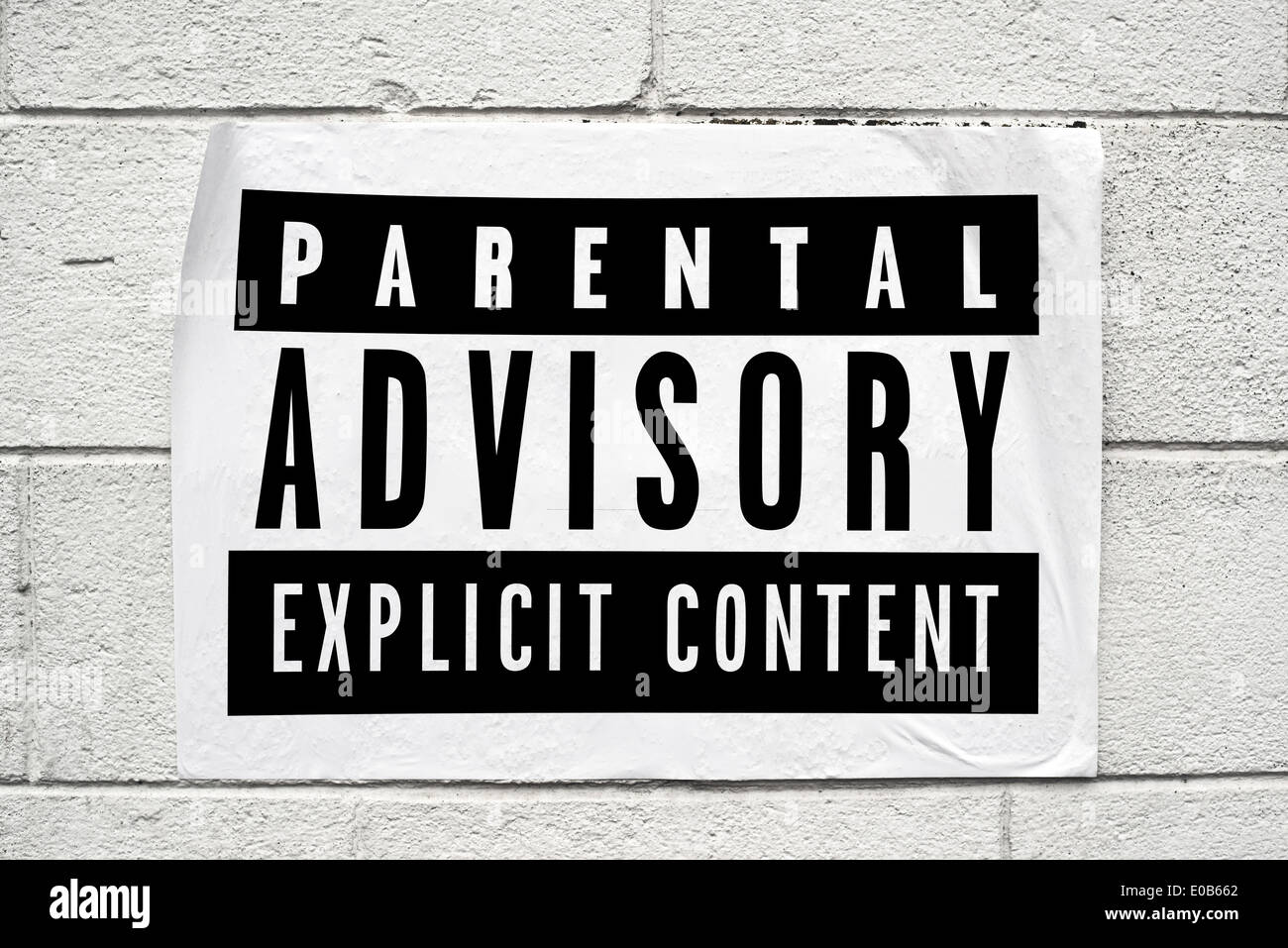Parental advisory label printed on poster on the wall Stock Photo