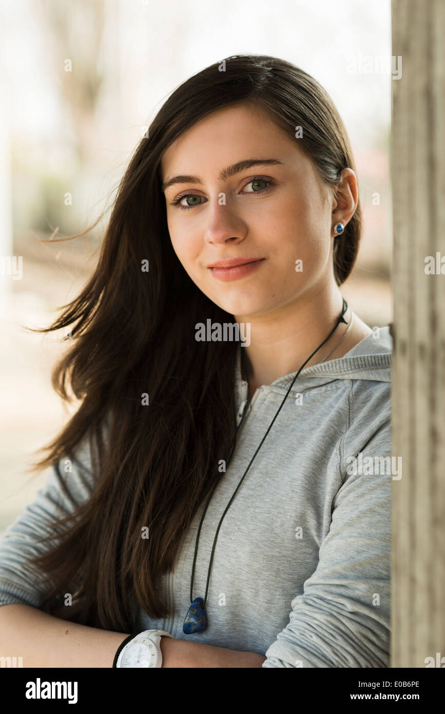 Portrait of smiling teenage girl Stock Photo - Alamy