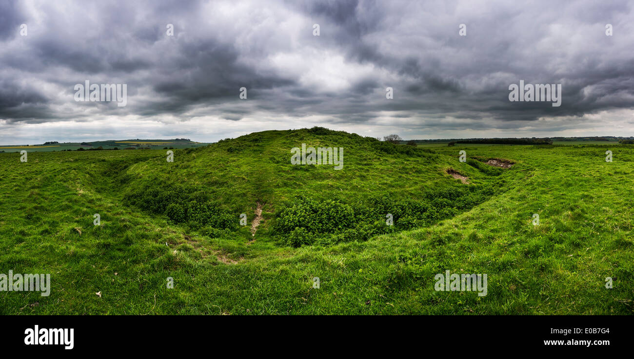 A Bronze Age bowl barrow within Windmill Hill Neolithic causewayed enclosure near Avebury, Wiltshire, UK Stock Photo