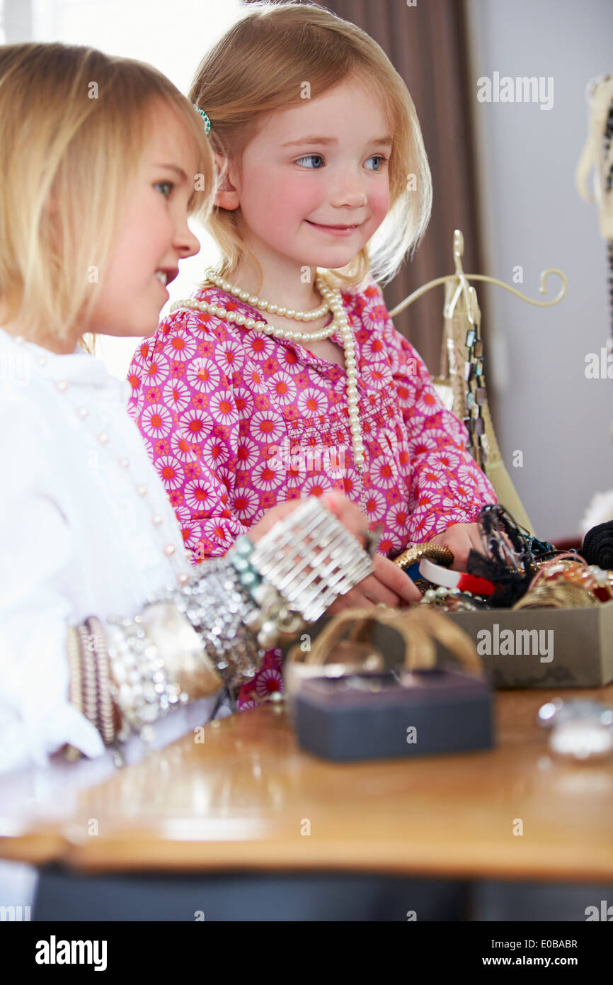 Two Girls Playing With Jewelry And Make Up Stock Photo