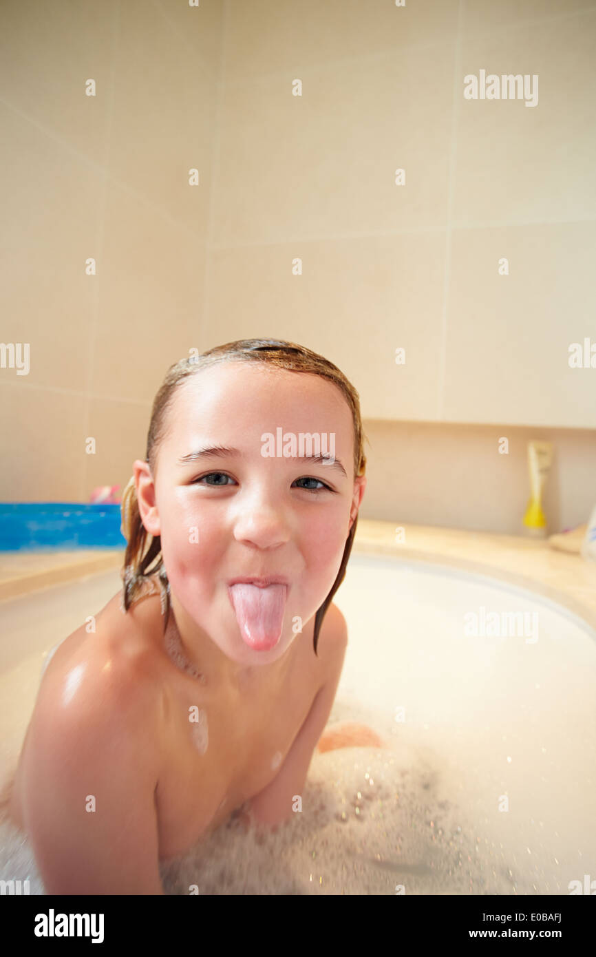 Girl In Bath Sticking Out Tongue Stock Photo