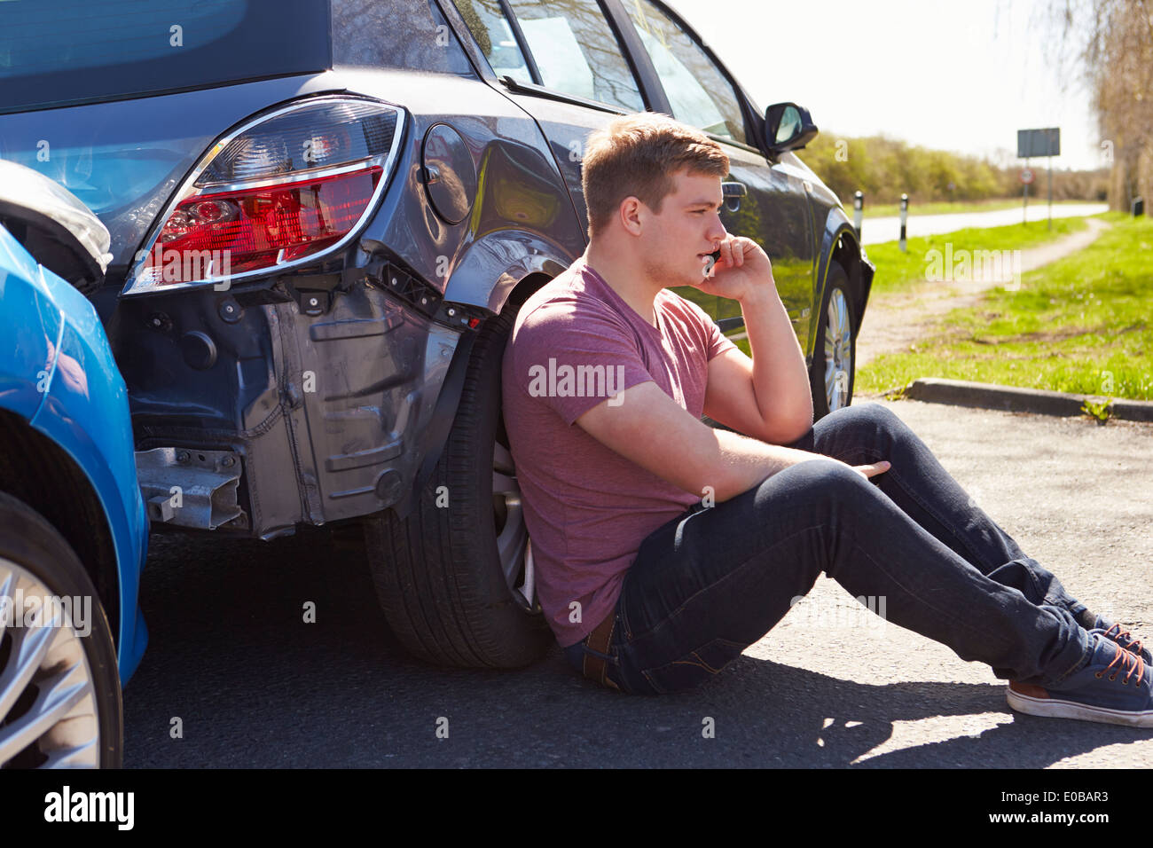 Warning Triangle By Two Cars Involved In Accident Stock Photo