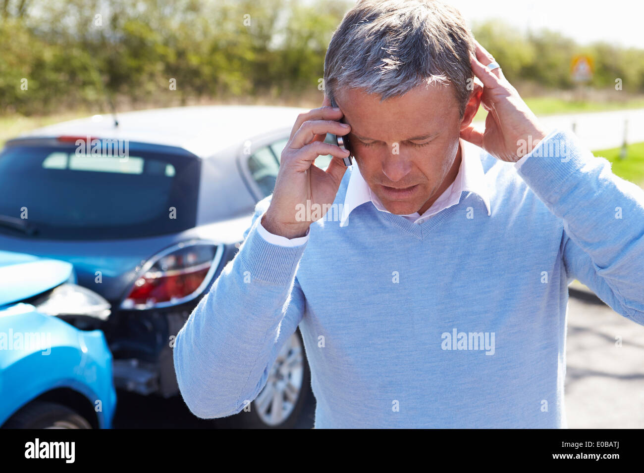 Driver Making Phone Call After Traffic Accident Stock Photo
