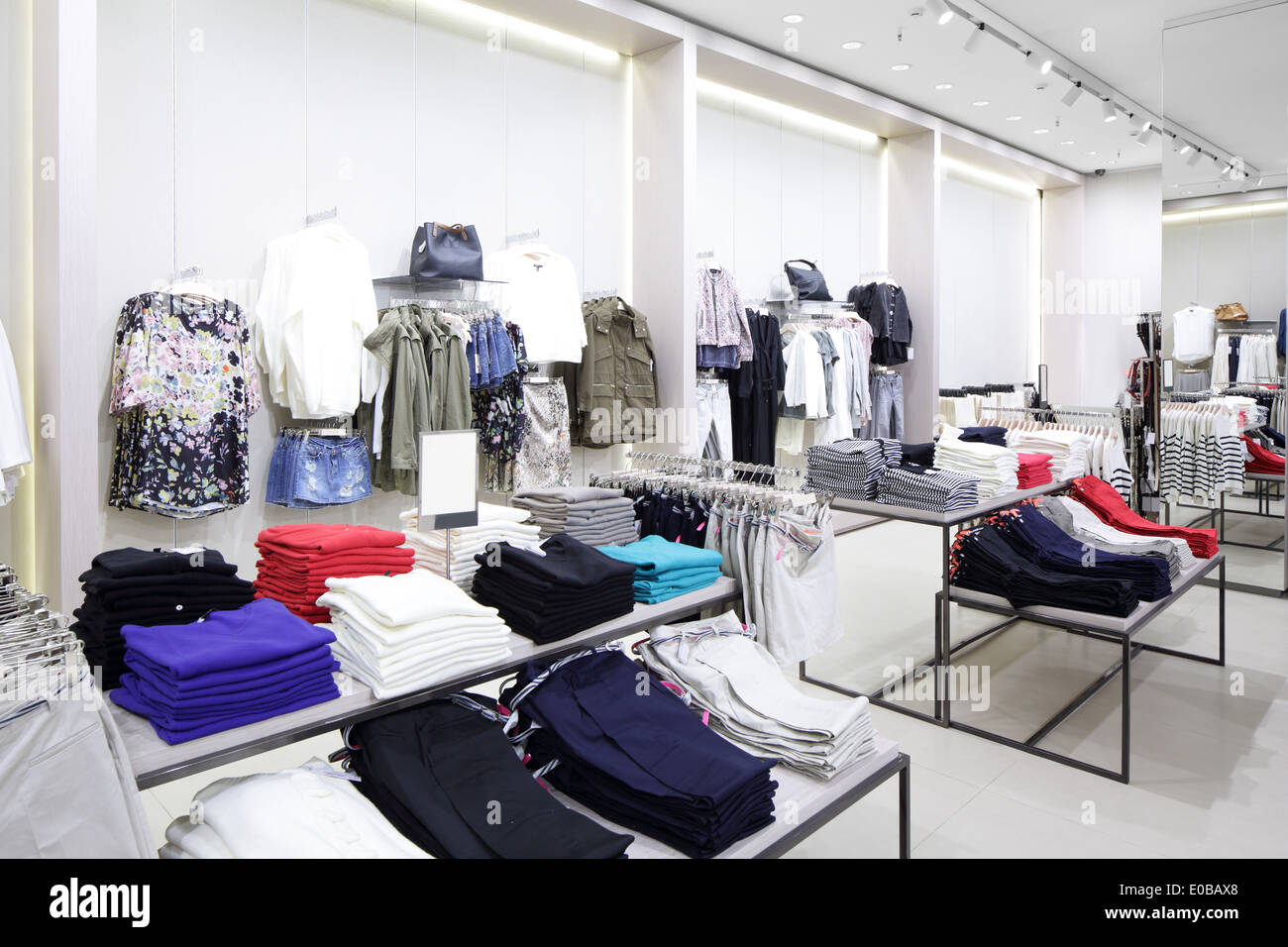luxury and fashionable brand new interior of cloth store Stock Photo ...
