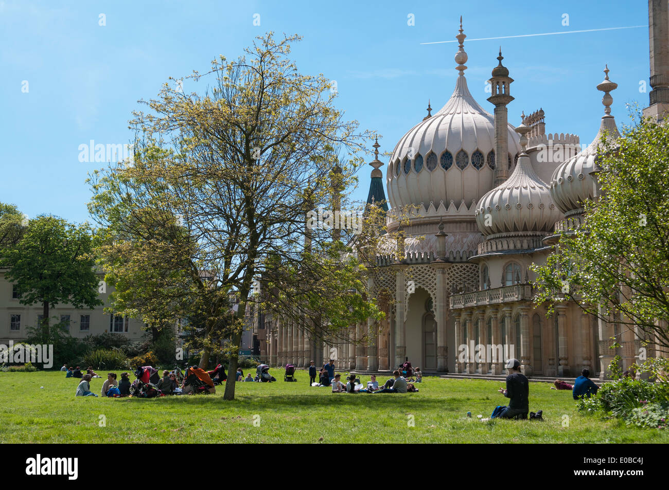 Relaxing on the grass in front of the Royal Pavillion. Brighton  East Sussex UK Stock Photo