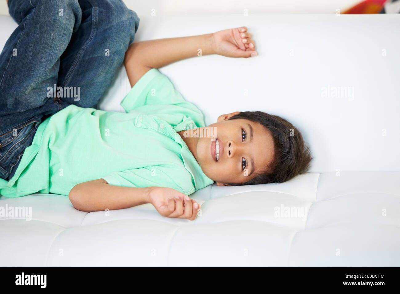 Boy Playing On Sofa Stock Photo