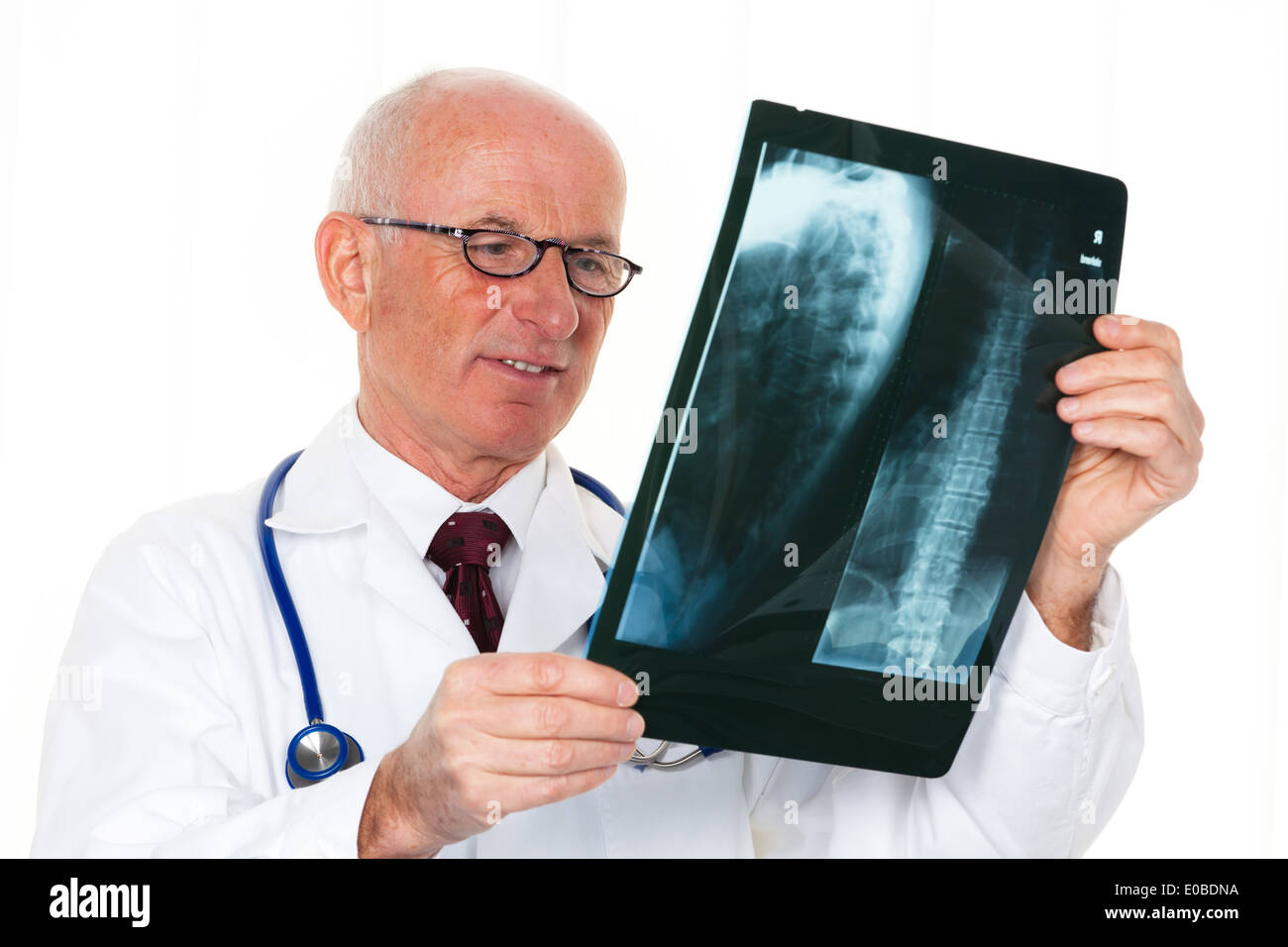 A X-ray examination doctor with a X-ray picture in the medical practise Stock Photo