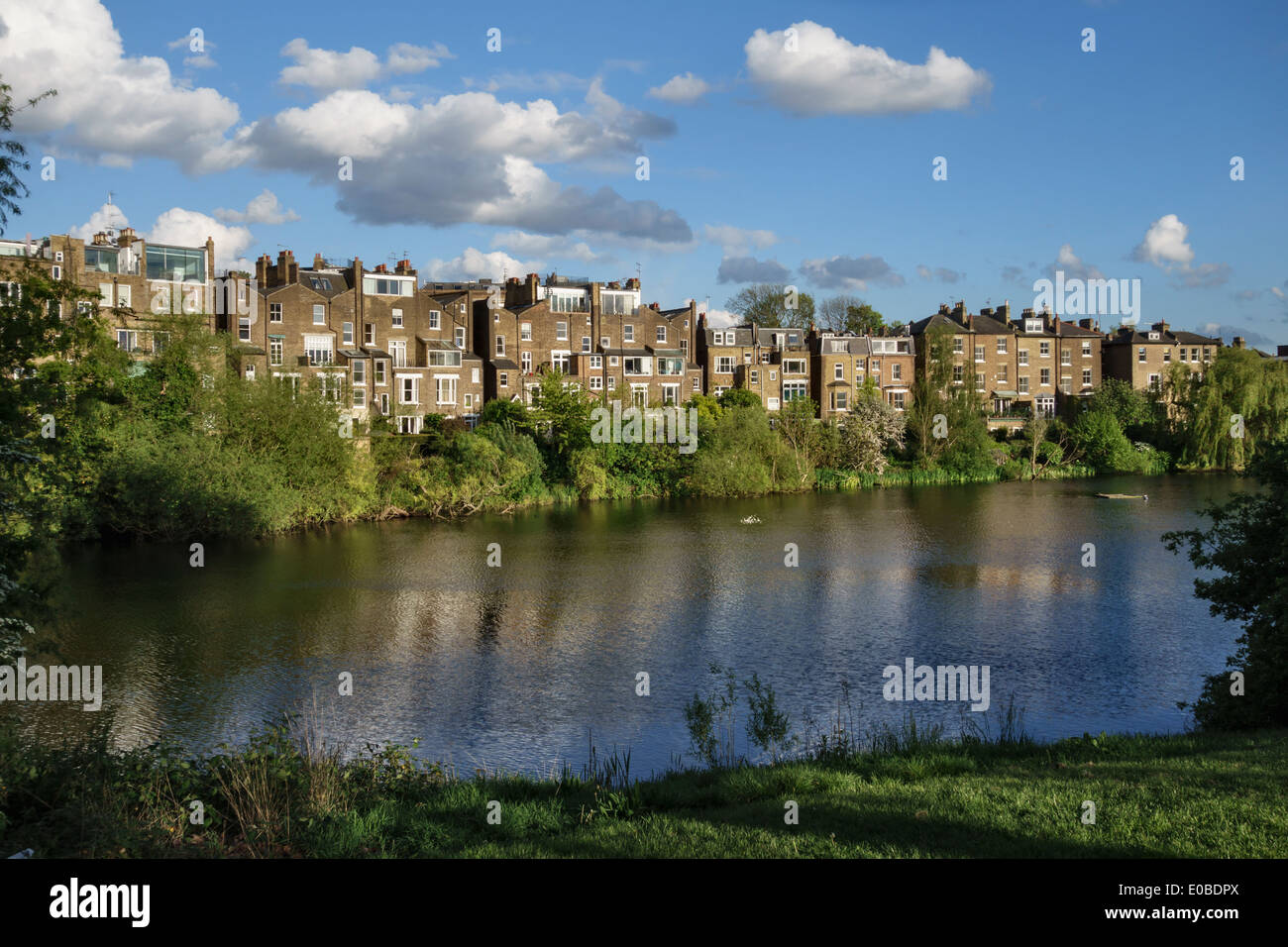 Hampstead No 1 Pond with the houses of South Hill Park, Hampstead Heath, London, UK Stock Photo