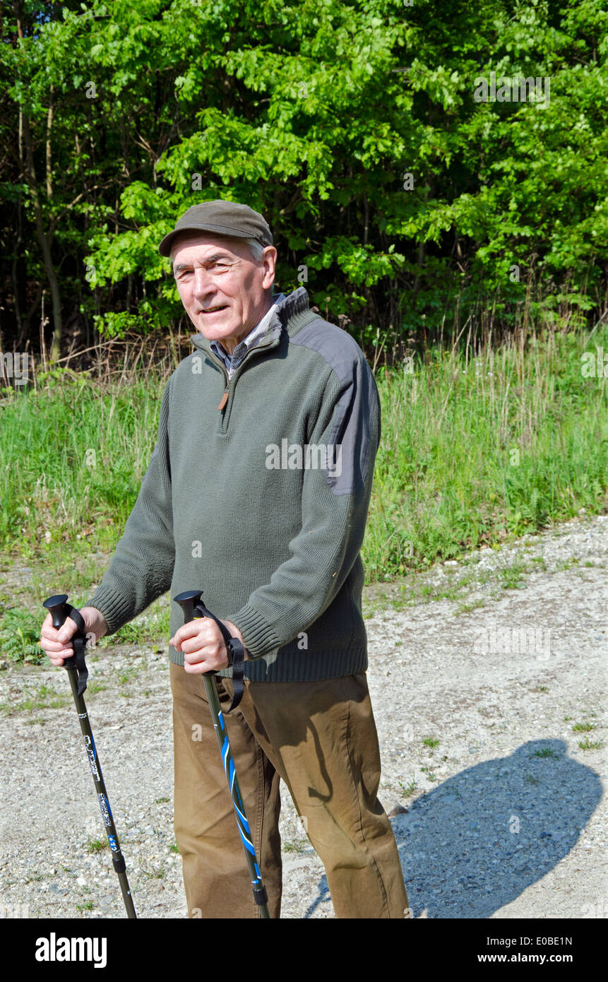 The senior man by nordic walking Stock Photo