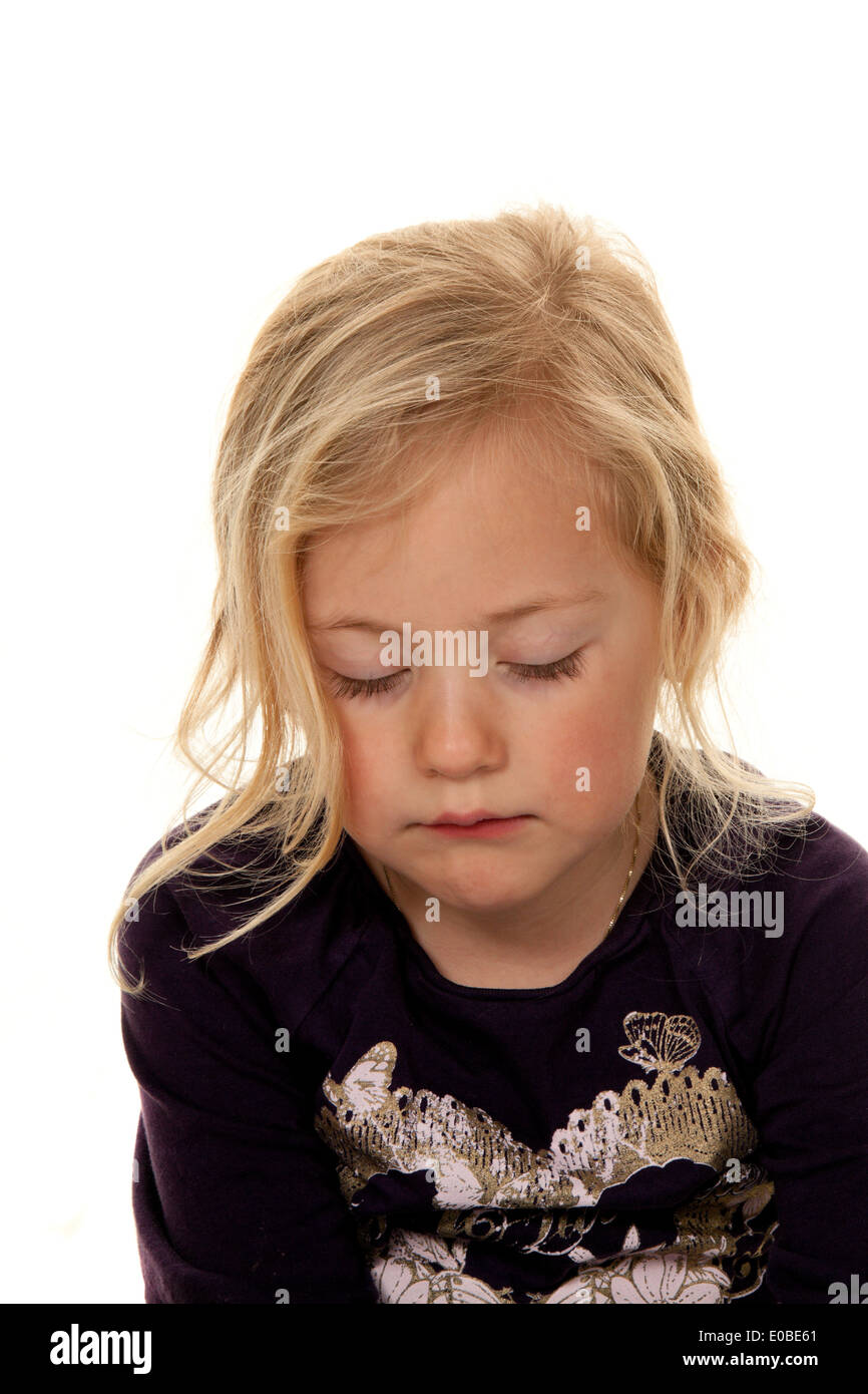 Portrait of a girl. Child head. Before white background, Portrait eines Maedchens. Kinderkopf. Vor weissem Hintergrund Stock Photo