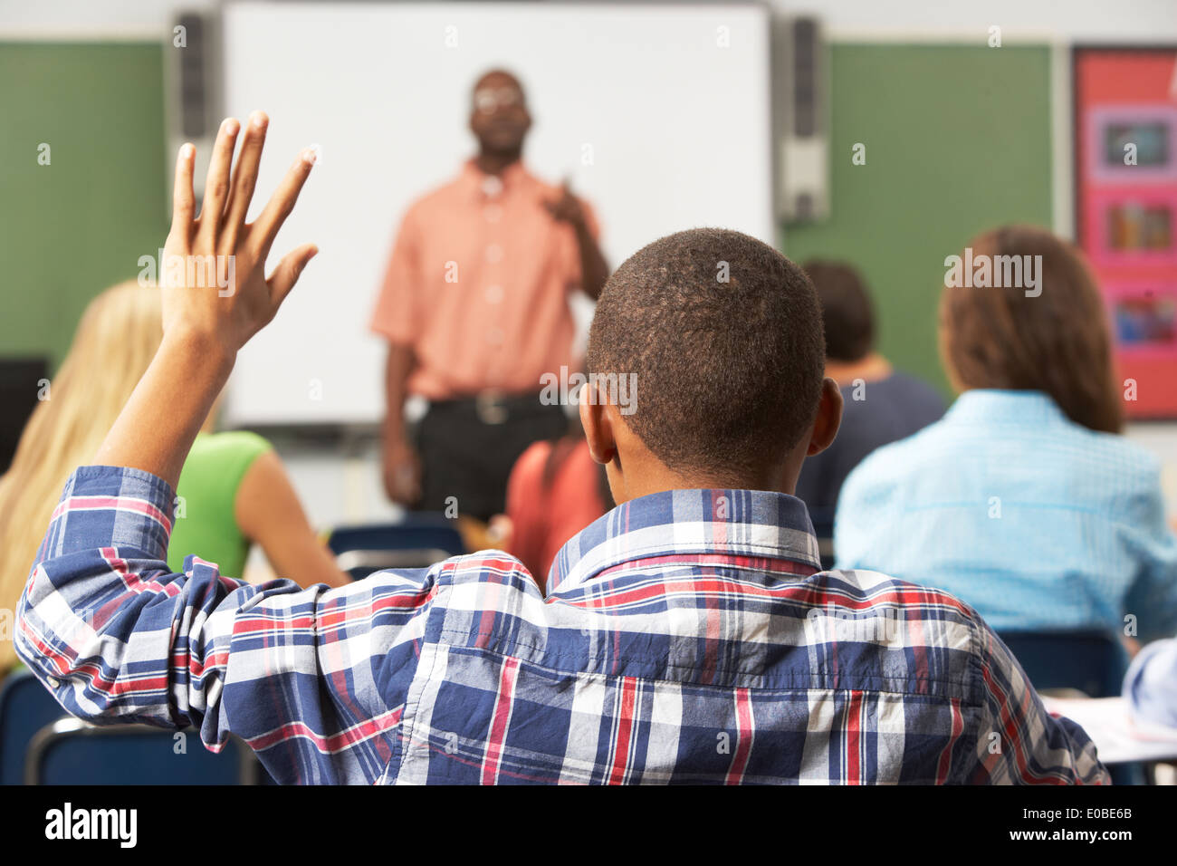Present Raising Hand Hispanic student raising hand hi-res stock photography and images - Alamy