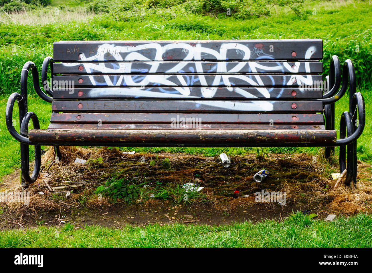 An Empty Park Bench With Graffiti And Empty Beer Cans Scattered Around By The River Soar In Leicestershire Stock Photo Alamy