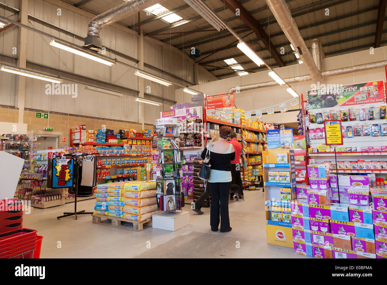 Customer inside Jollyes Petfood Superstore Stock Photo Alamy