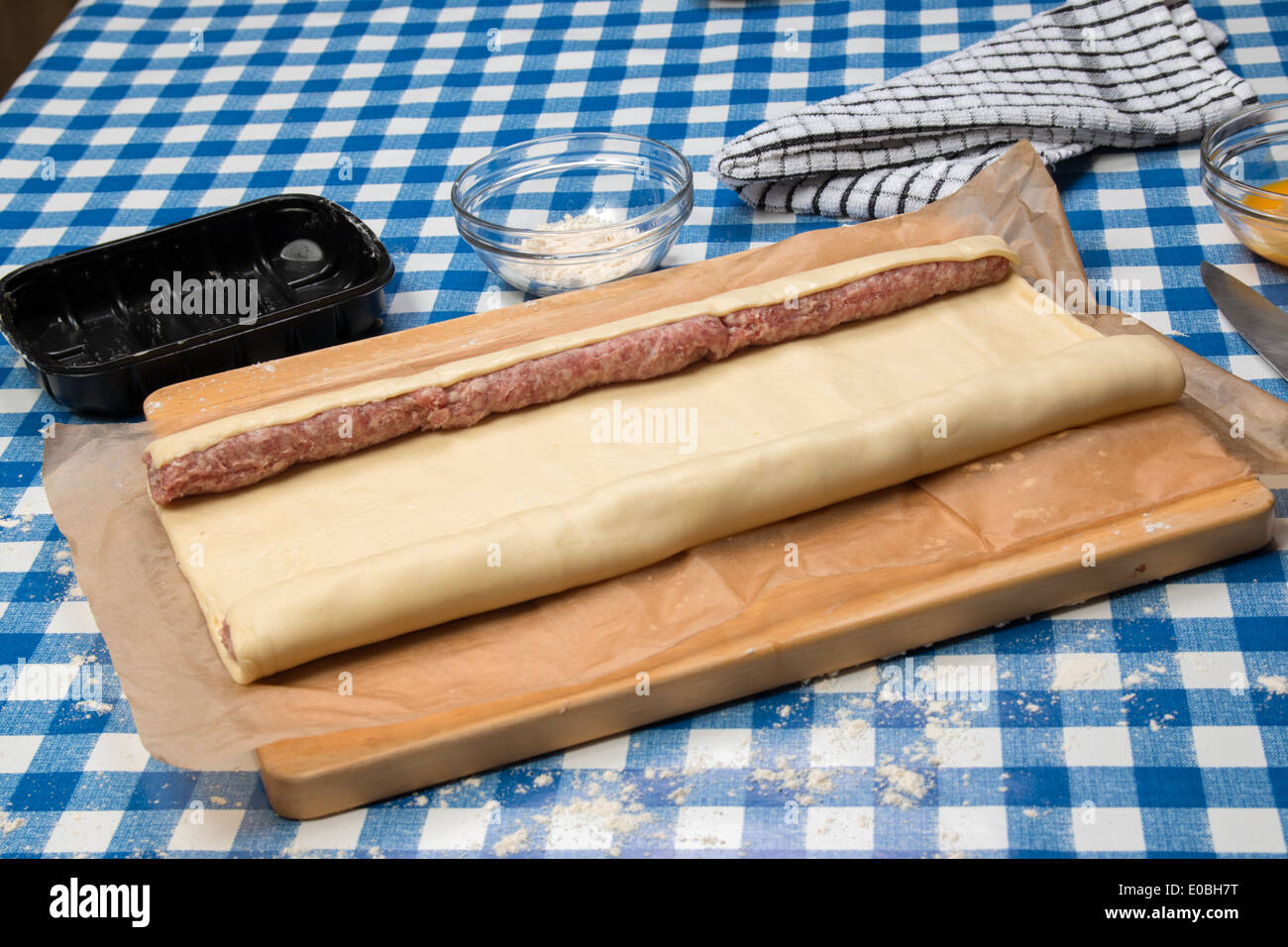Making sausage rolls using ready rolled pastry sausages in place