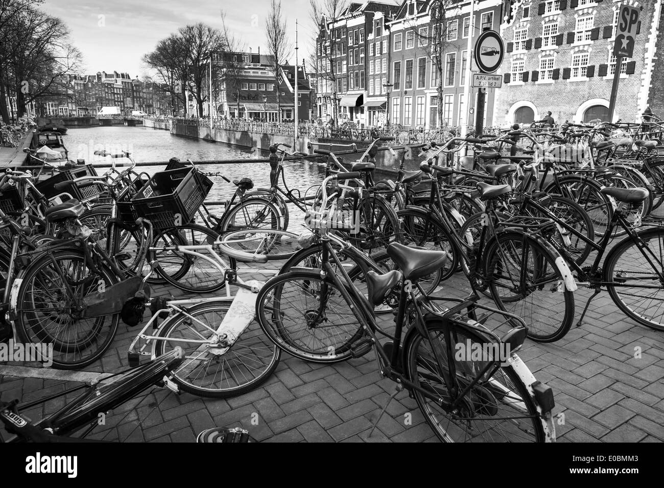 AMSTERDAM, NETHERLANDS - MARCH 19, 2014: Large group of bicycles stand on a parking place Stock Photo