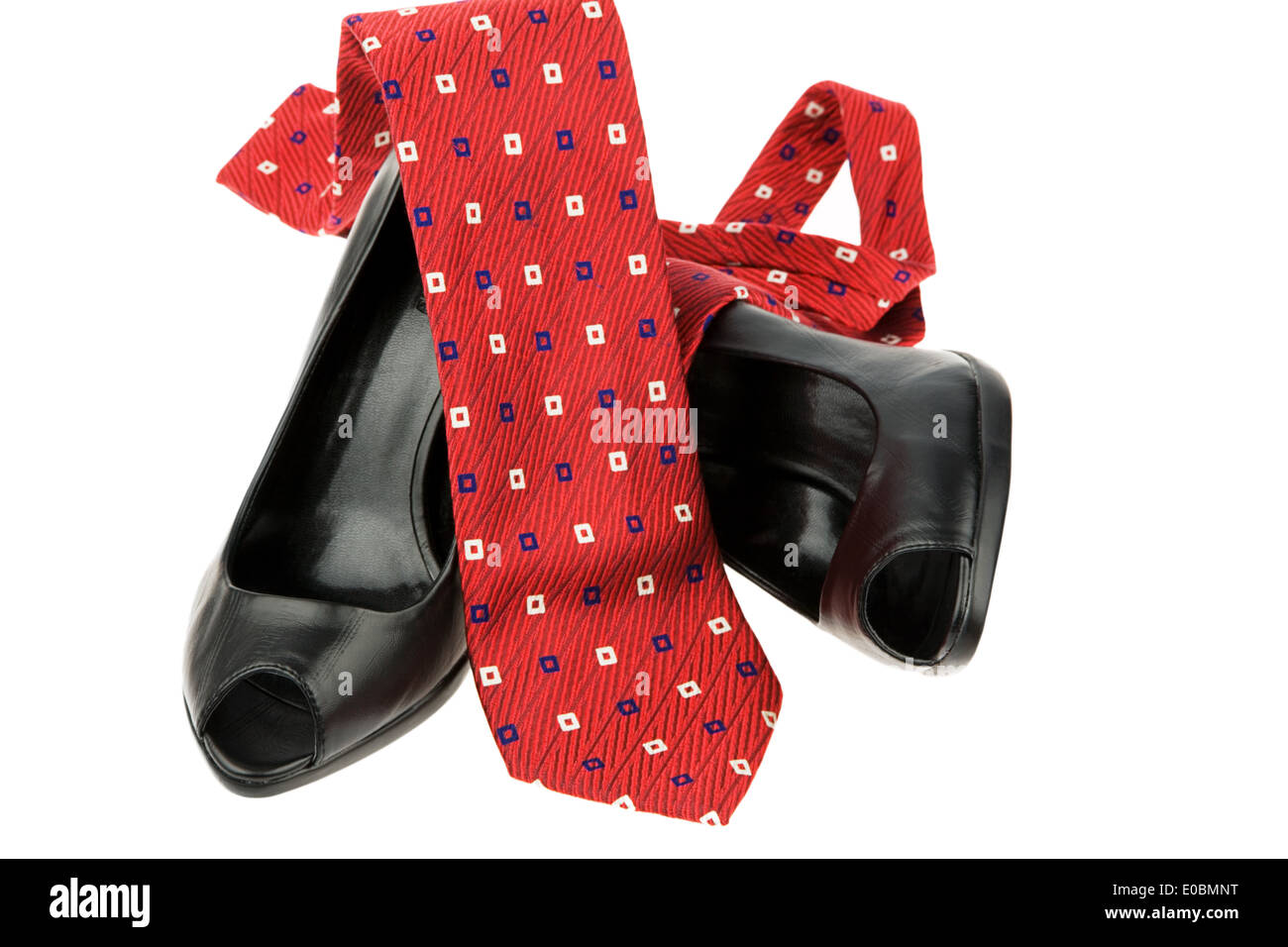 Black ladies shoes of a businesswoman and a red tie, Schwarze Damen Schuhe einer Geschaeftsfrau und eine rote Krawatte Stock Photo