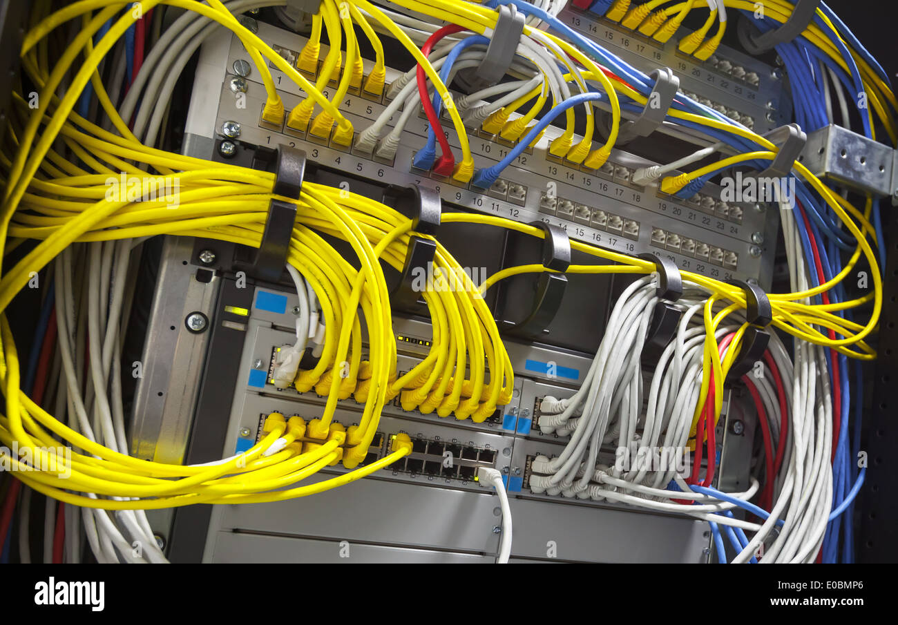 Large network hub and connected colorful cables Stock Photo