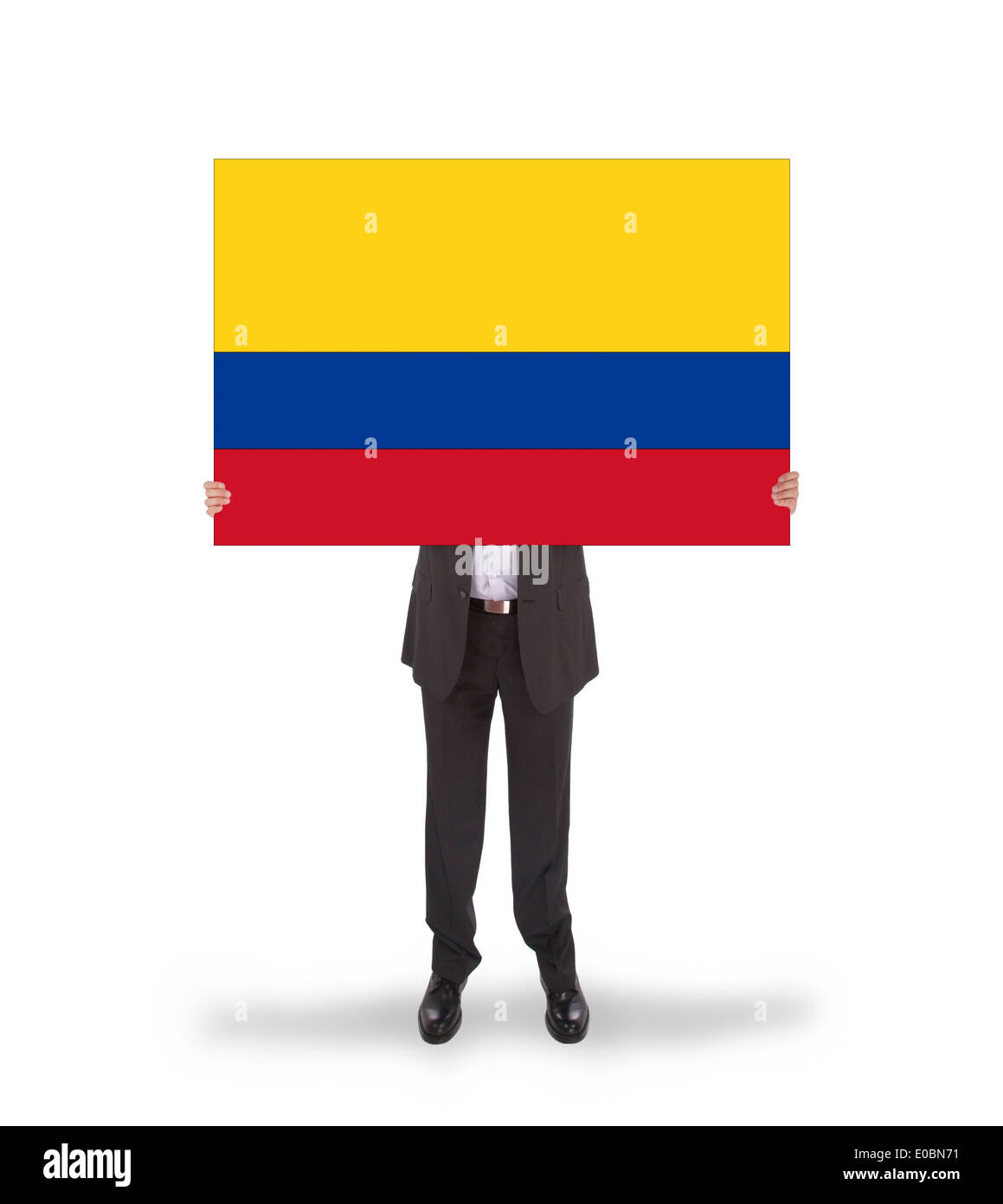 Businessman holding a big card  flag of Colombia  isolated on white Stock Photo