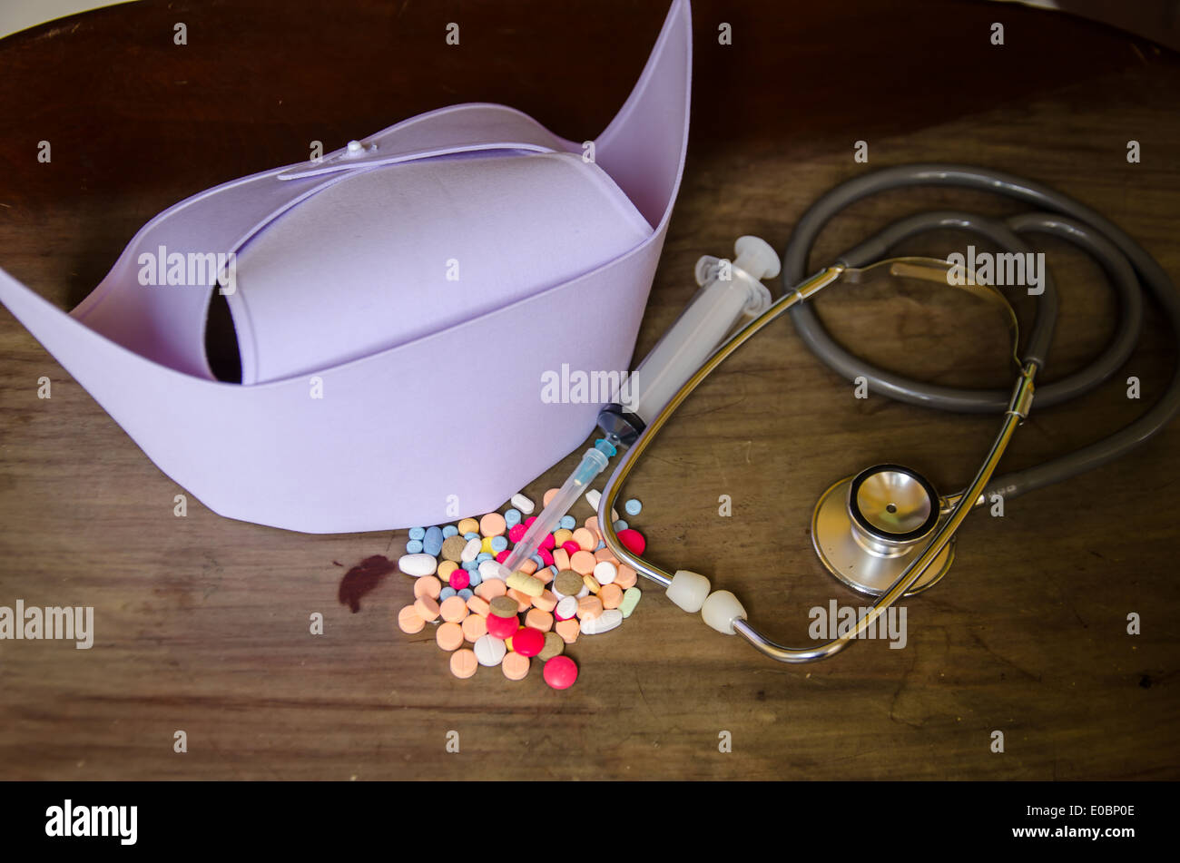 stethoscope and nurse cap on wood with medicine Stock Photo Alamy