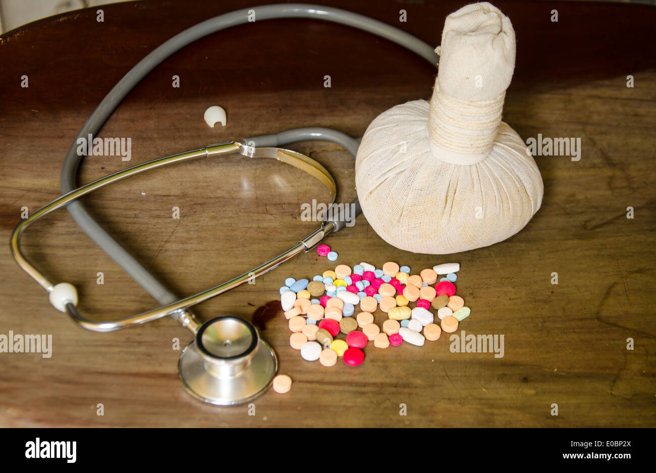 compress ball herbal with medicine and stethoscope Stock Photo
